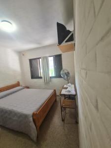 Ένα ή περισσότερα κρεβάτια σε δωμάτιο στο Hostería Los Sauces