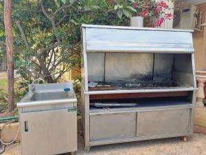 a food stand with a sink and a stove at Resort altayar Villa altayar 2- Aqua Park in Sidi Krir 