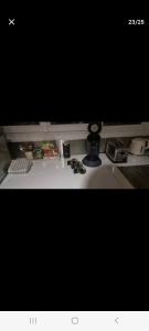 a computer monitor sitting on top of a desk at T3 cosy, calme & lumineux proche Eurexpo, Groupama in Saint-Priest