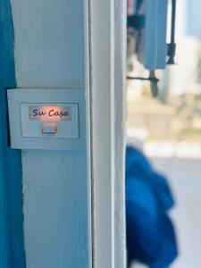 a sign on a wall that says six case at Su Casa KEA in Korissia