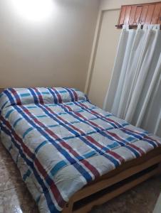 En eller flere senge i et værelse på Complejo Extremo 4