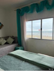 En eller flere senge i et værelse på Mansão beira mar