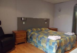 Postel nebo postele na pokoji v ubytování Leo Hotel Motel