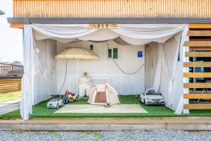 a tent with cars parked inside of it at Gapyeong Olden Caravan & Pension - Pet Friendly in Gapyeong