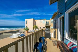 a balcony with a view of the beach at Stunning Ocean Views - Recently Renovated Home & Warm Sunsets in San Diego