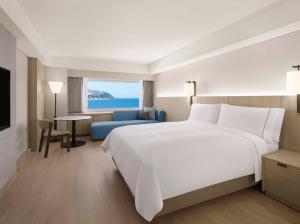 Postel nebo postele na pokoji v ubytování The Westin Josun Busan