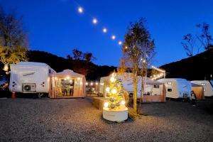 a fire hydrant in front of a bunch of tents at Chuncheon Healing Bridge in Chuncheon