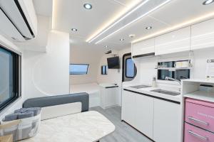 a kitchen and living room of a recreational vehicle at Pohang Uni's Sea Guryongpo in Pohang