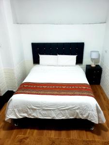 Postel nebo postele na pokoji v ubytování Cusco de mis Sueños Hostal - II