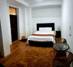 Postel nebo postele na pokoji v ubytování Cusco de mis Sueños Hostal - II