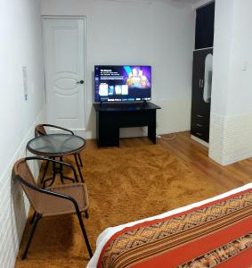 TV a/nebo společenská místnost v ubytování Cusco de mis Sueños Hostal - II