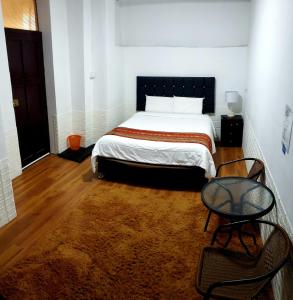 Postel nebo postele na pokoji v ubytování Cusco de mis Sueños Hostal - II