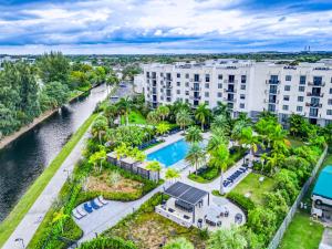 an aerial view of a resort with a pool and buildings at Modern 1 Bedroom In The Heart Of Downtown Doral in Hialeah Gardens