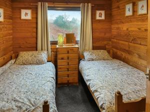 Postelja oz. postelje v sobi nastanitve Cumstoun Lodge