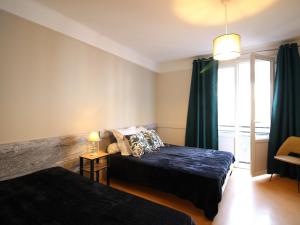 En eller flere senger på et rom på Appartement Mont-Dore, 1 pièce, 2 personnes - FR-1-415-151