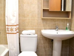 a bathroom with a toilet and a sink at Casa con Encanto en el Centro de Peralada: 6 Personas, WiFi, SMART TV, A/C - ES-228-172 in Peralada +17 photos