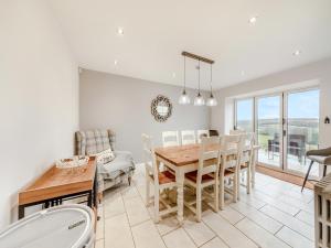 a kitchen and dining room with a table and chairs at Binchester Crag Farm in Bishop Auckland