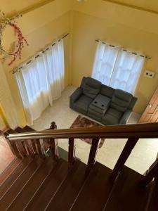 a living room with a couch and two windows at Paradise panglao pool villa 