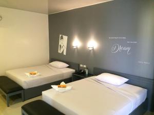 Letto o letti in una camera di GC Suites