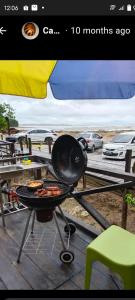 a grill with food on top of a table at The Mangrove in Sematan