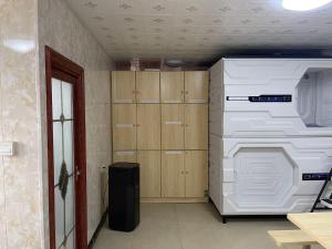 a laundry room with a washer and dryer in it at Efate Motel in Port Vila