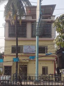 a building with a blue pole in front of it at Hotel Skyking in Gauripur