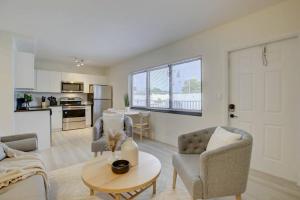 a living room with a couch and chairs and a table at 2BR Cozy FLL Retreat! in Fort Lauderdale