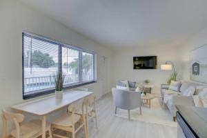 a living room with a couch and a table at 2BR Cozy FLL Retreat! in Fort Lauderdale