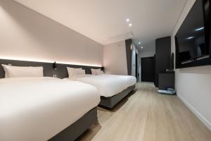 Krevet ili kreveti u jedinici u objektu Hound Hotel Mokpo Peace Plaza