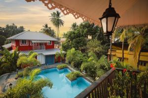 a view of a resort with a swimming pool at Cherryleen Resort Nagaon Alibaug in Nagaon