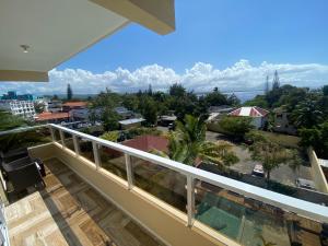 a balcony with a view of the city at Sosua Inn Hotel in Sosúa