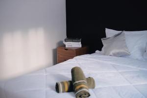 Tempat tidur dalam kamar di D Black Houze Banyuwangi