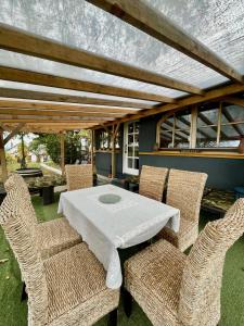 a table and chairs on a patio with a table and chairs at Juhfark Apartman Varsádi Wineyard in Somlóvásárhely