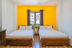 Letto o letti in una camera di Khách Sạn Lối Về Đà Lạt