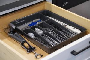a drawer filled with utensils in a box at Modern, Private Retreat near Golden Gate Park and UCSF with On-Site Parking in San Francisco