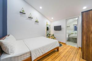 Letto o letti in una camera di Khách Sạn Lối Về Đà Lạt