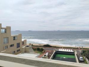 a view of the ocean from the balcony of a building at 5 Telena in Umdloti