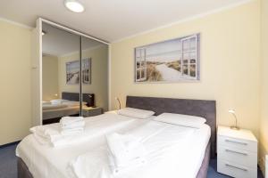 Ένα ή περισσότερα κρεβάτια σε δωμάτιο στο Ostseewelle 19