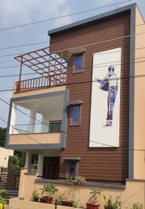 a building with a large advertisement on the side of it at 4 KING SIZE BEDROOM DUPLEX VILLA in Hyderabad