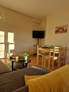 a living room with a couch and a table at Central location in London