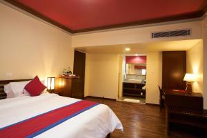 Voodi või voodid majutusasutuse Shambaling Boutique Hotel toas