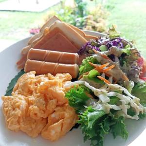 a plate of food with shrimp and a salad at Quality Time Farmstay: Bamboo House in Ban Pa Lau