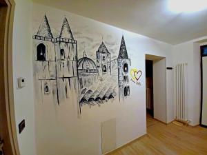 a drawing of a castle on a wall at pesa apartment B&B in Ascoli Piceno