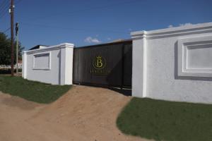 a building with a b sign on the side of it at Barcalla Hotel Apartments in Maseru