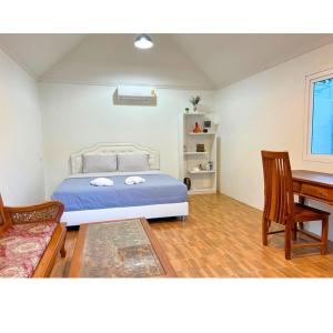 Ένα ή περισσότερα κρεβάτια σε δωμάτιο στο Quality Time Farmstay: River House