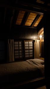 Postel nebo postele na pokoji v ubytování Hostel & Tatami Bar Uchikobare -内子晴れ-