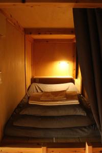 Postel nebo postele na pokoji v ubytování Hostel & Tatami Bar Uchikobare -内子晴れ-