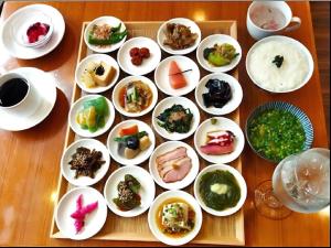 a tray filled with plates of food on a table at APA Hotel Ningyocho-eki Kita in Tokyo