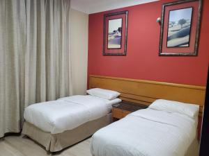 Postel nebo postele na pokoji v ubytování Remal Ibri hotel
