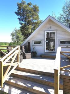 a large wooden deck in front of a house at Årsta strand in Stockholm